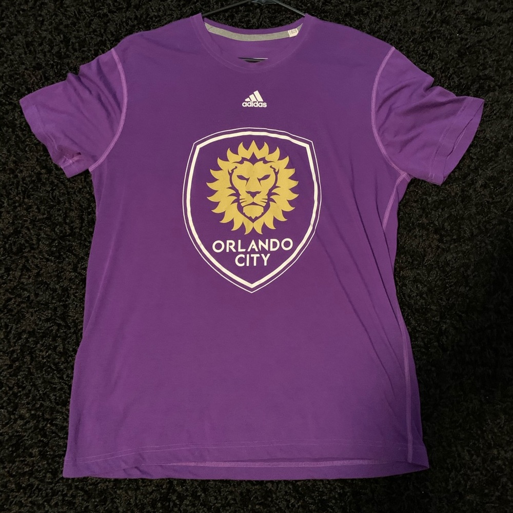 Orlando City soccer jersey.